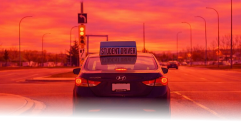 Student driver training car with student driver sign — Driving Hero Academy